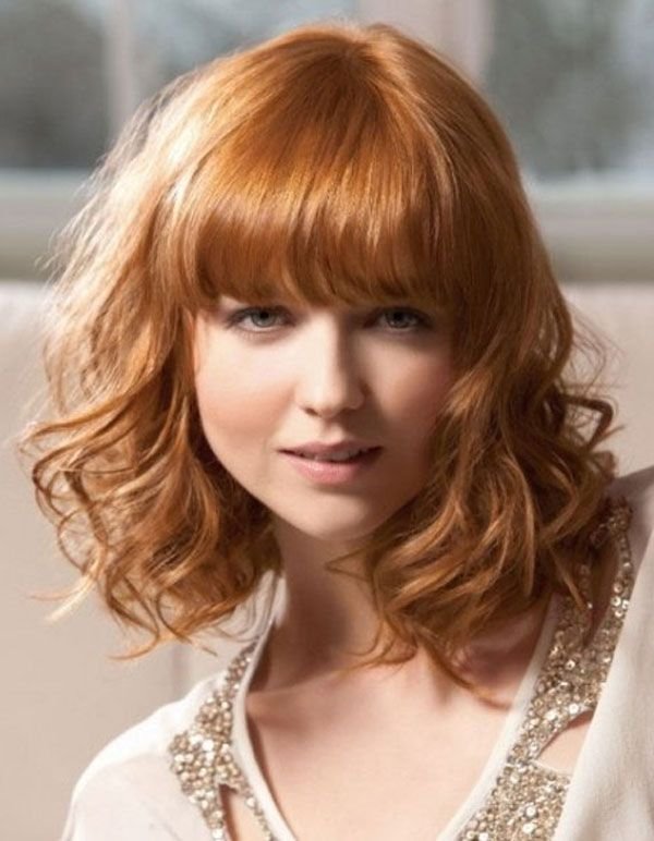 Blonde hair with straight bangs and curls around the shoulders